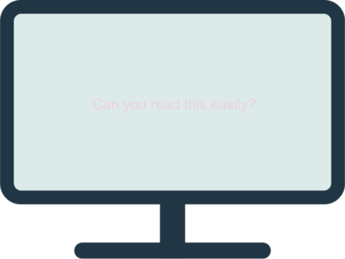 A computer monitor with a light blue screen and light pink text that reads, "Can you read this easily?"